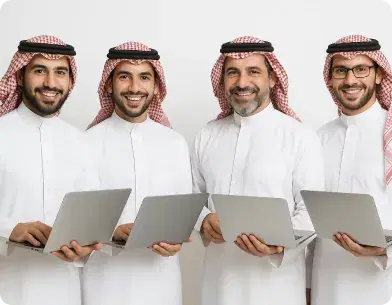  professional in Saudi attire gives a thumbs-up while using a laptop, demonstrating the simplicity and effectiveness of Deepora's communication solutions.